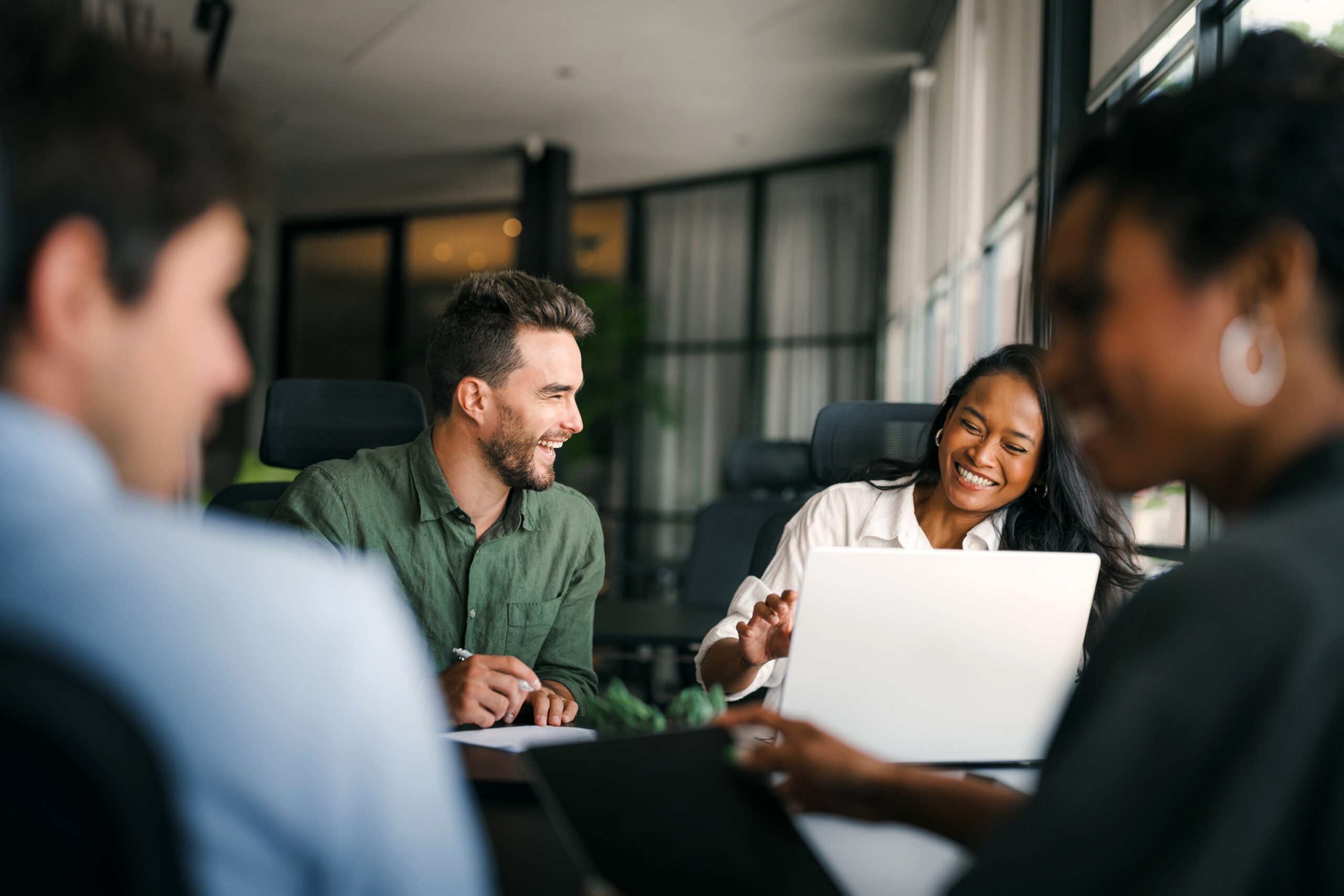 A finance team working together during a collaborative meeting.
