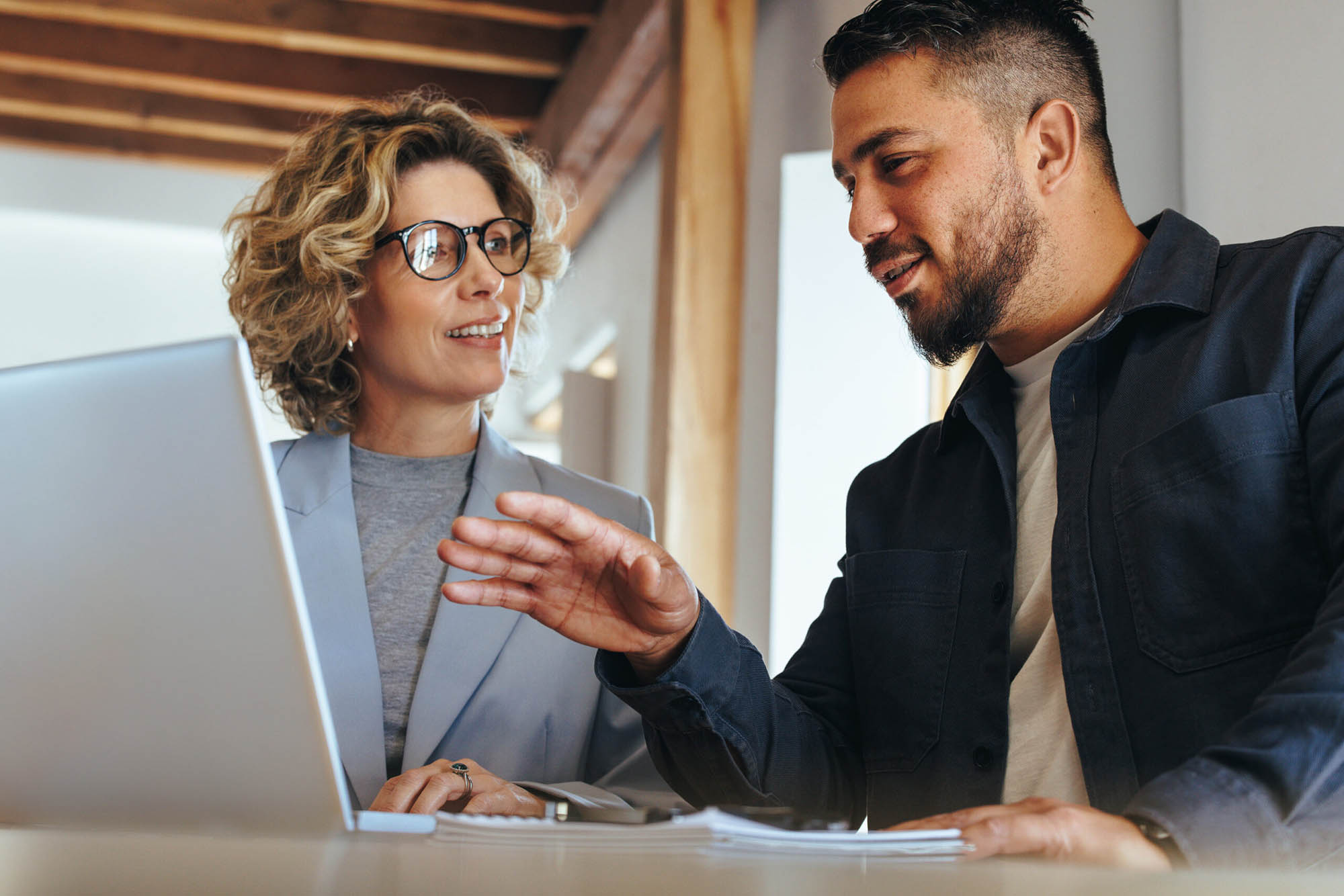 Two finance professionals collaborating on Trintech Planful integration to improve financial reporting accuracy and efficiency